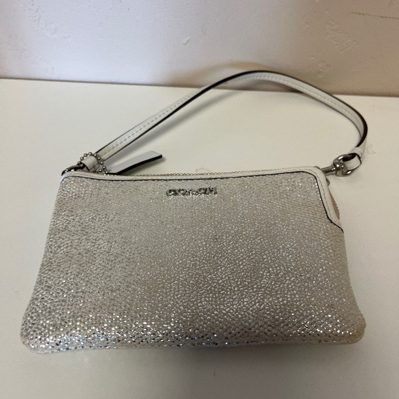 Silver sparkle Coach wristlet with white leather trim and key fob - Picture 1 of 3
